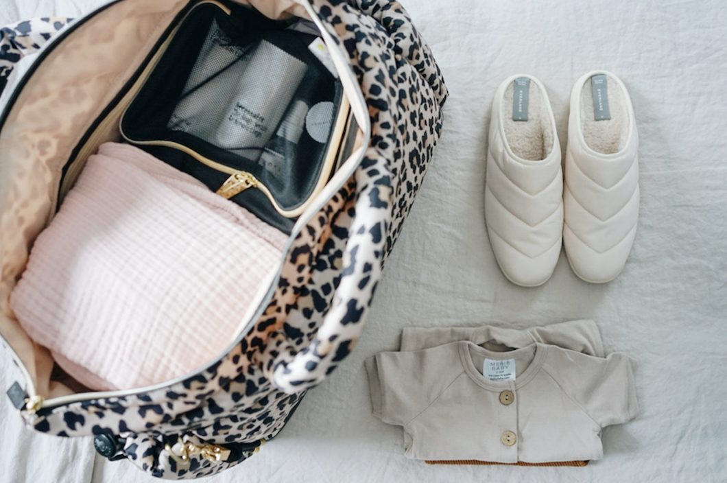 Hospital bag with slippers for mom and shoes for baby