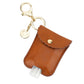 Cute 'n Clean™ Hand Sanitizer Charm Diaper Bag Accessory Itzy Ritzy Cognac