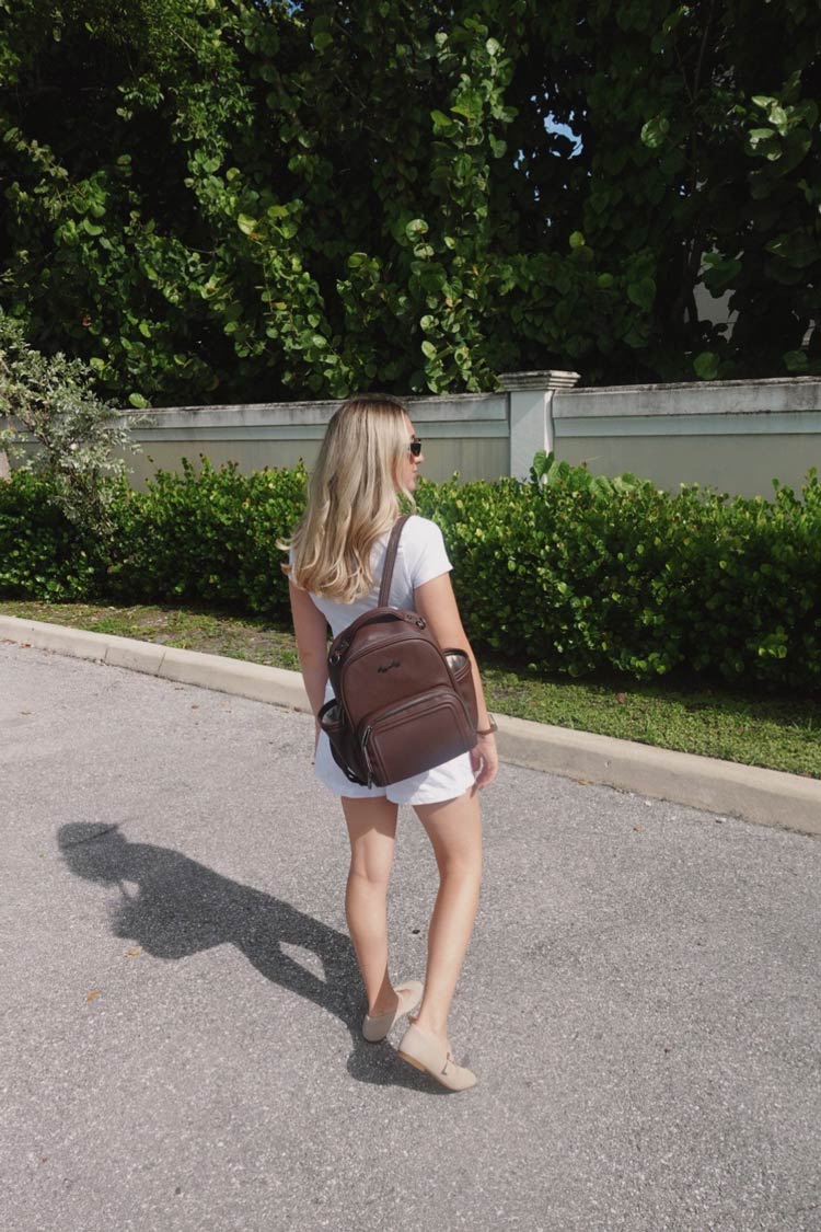 Lifestyle image of mom wearing diaper bag