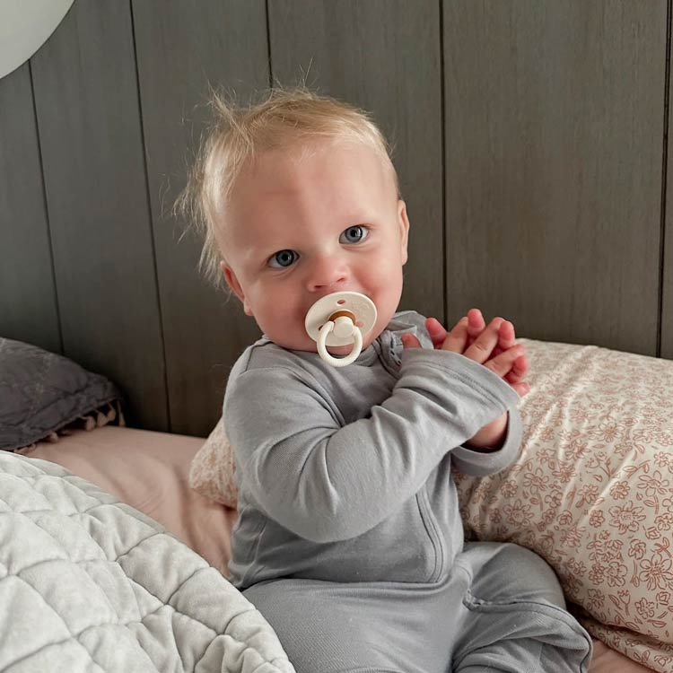 Baby with Itzy Ritzy Pacifier