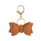 Boss Bow™ Diaper Bag Bow Charm Diaper Bag Accessory Itzy Ritzy Cognac