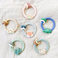 Ritzy Rattle™ with Teething Rings Teethers Itzy Ritzy®  Rainbow Neutral Rainbow Fox Dino Cactus Sloth